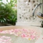 clean bathtube with fresh flower at villa vastu