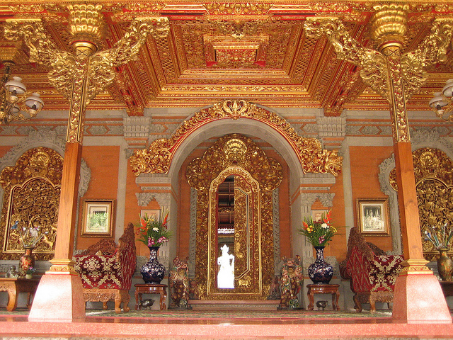 Puri Ubud carved golden wooden doors