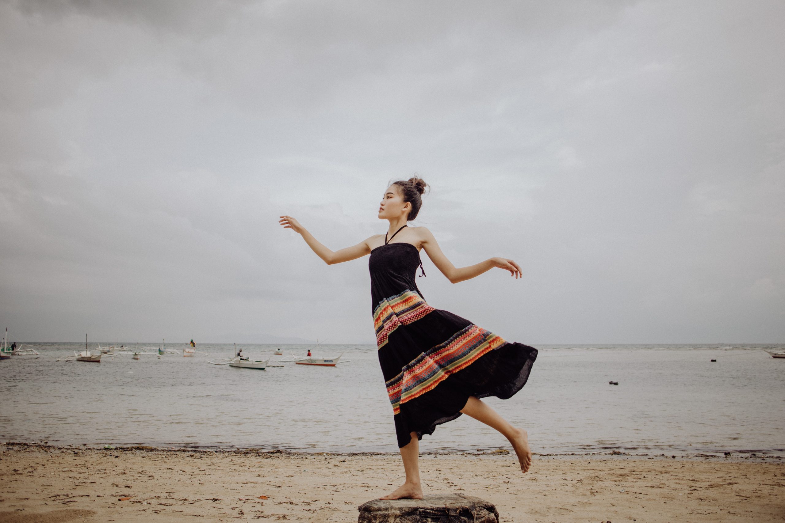 Lady posing for a picture at a beach
