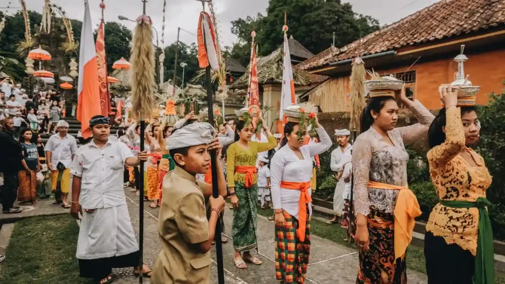 balinese people wearing bali traditional clothes in the temple ceremony