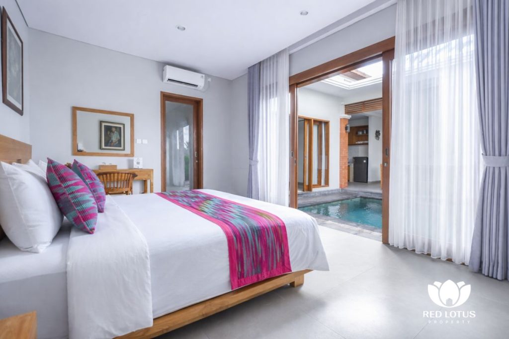 bedroom with private pool view at villa yuta ubud